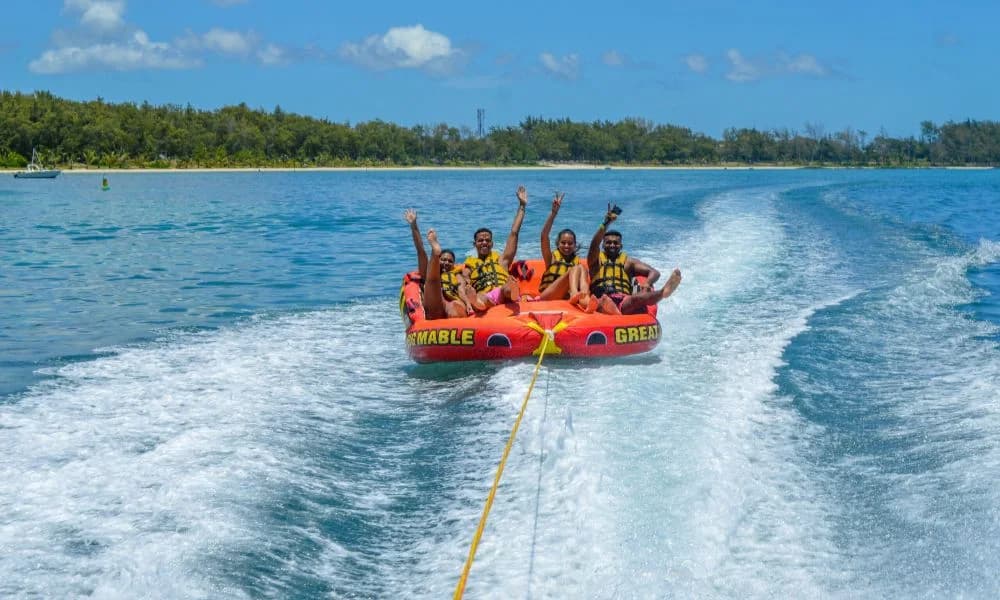 Guests enjoying an Aquacity tube ride at Belle Mare
