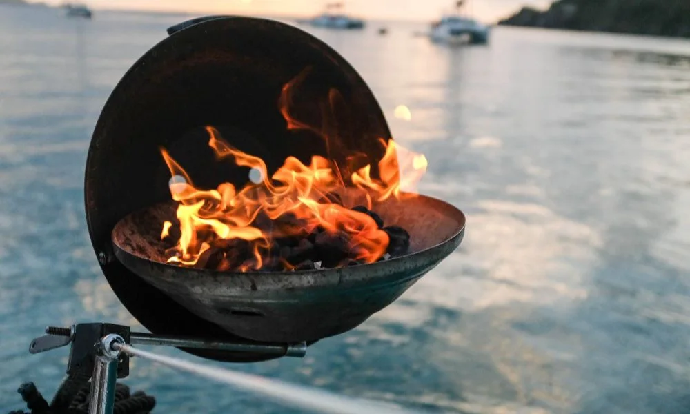 Barbecue grill on a boat with the lagoon behind