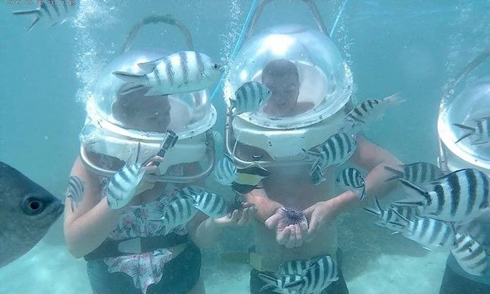 Aquacity undersea-walk guests exploring Belle Mare Lagoon