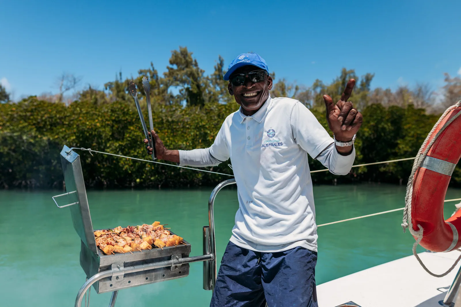 A crew member preparing the onboard barbecue