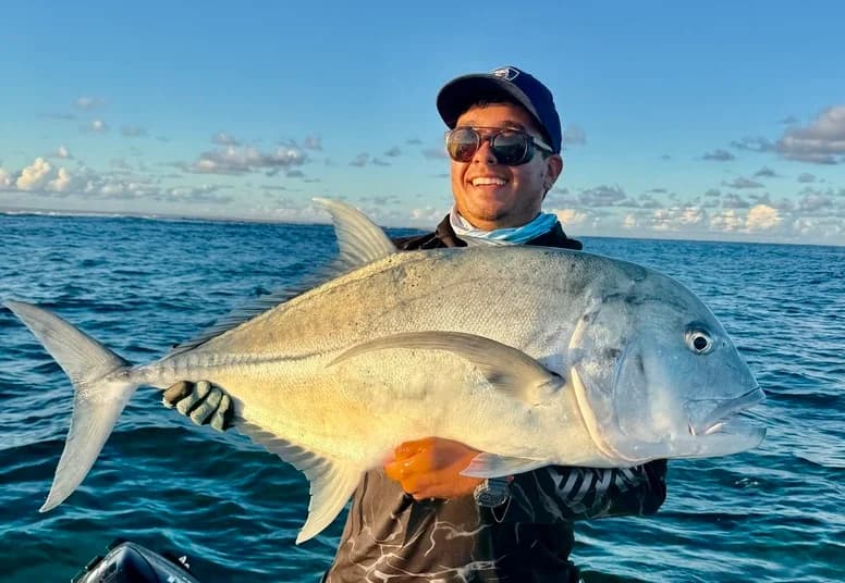 An angler working a lure beyond the reef in Mauritius