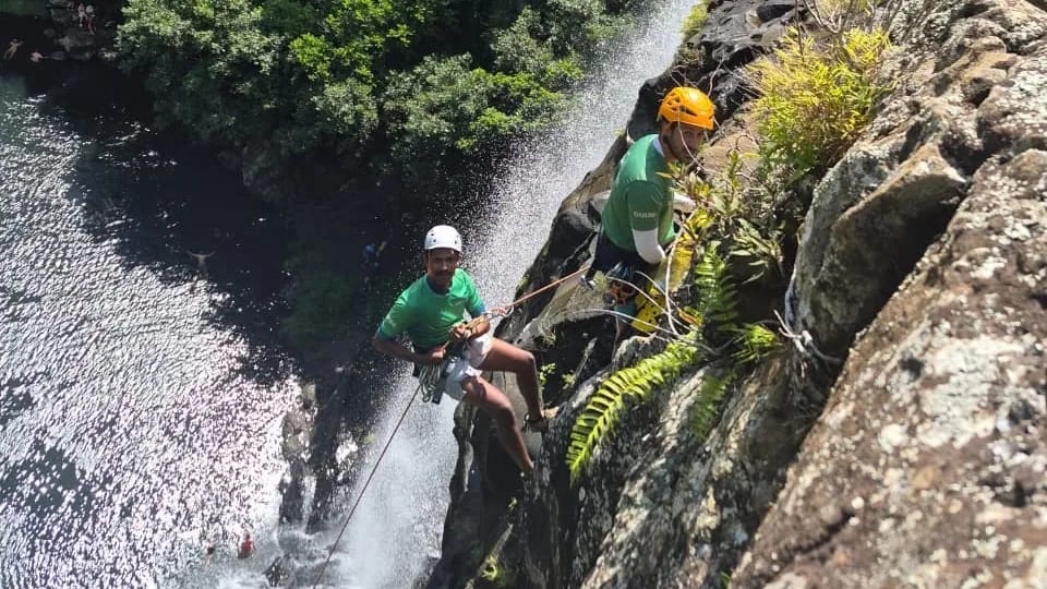 Several waterfall levels within the green Tamarind Falls gorge