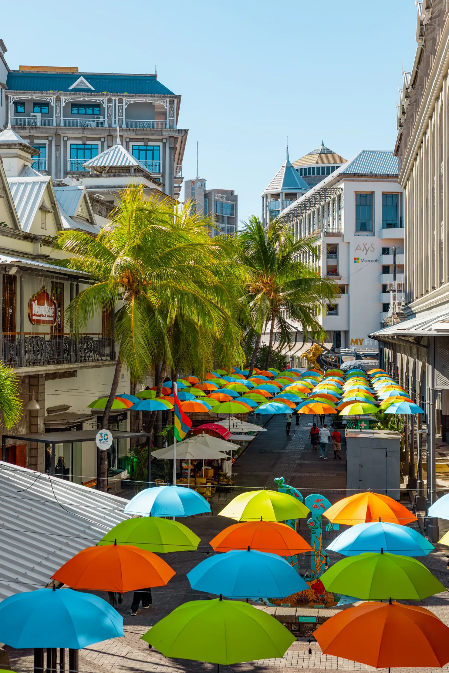 Colourful umbrellas over a street at Caudan Waterfront in Port Louis