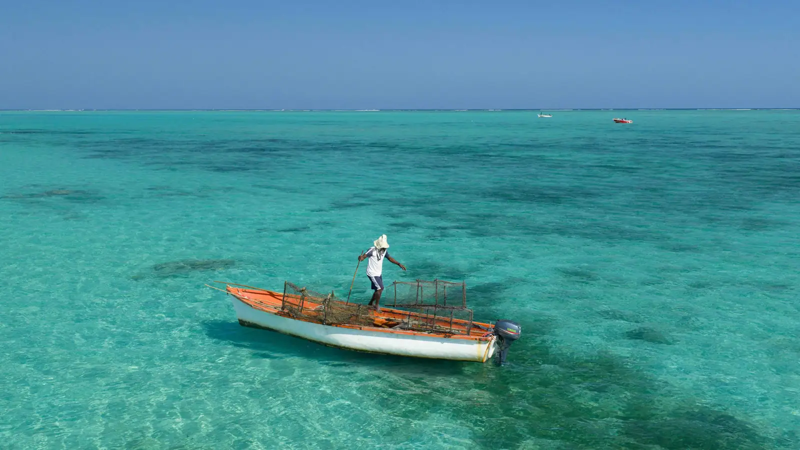 A local boat on clear Mauritius lagoon water